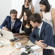 professional-employees-collaborating-medium-shot Responsabilità solidale e RC Professionale: un aspetto spesso sottovalutato